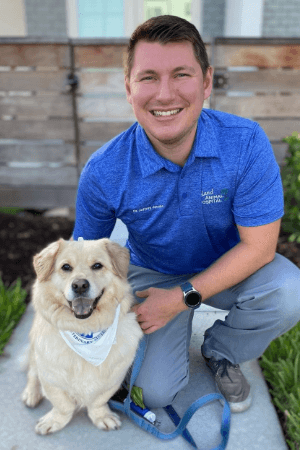 Dr Jeffrey Jacobs male veterinarian with brown hair posing with short sandy colored hair